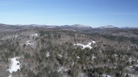 Drone aerial over trees and mountains in winter Stock Footage 114181584