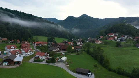 Drone aerial parallel smooth flying view of small village countryside Stock Footage 120072601