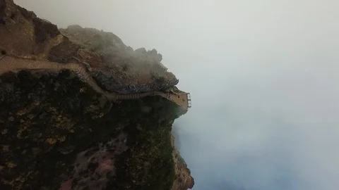Drone aerial of path leading to viewing point on top of Pico do Arieiro Video stock 114851460
