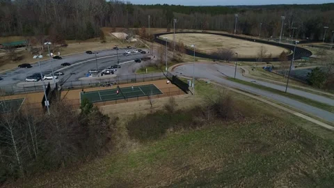 Drone Aerial Pull Away View From Walking Track Over Tennis Courts Stock Footage 219030551