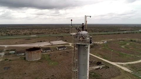 Drone aerial pull out from abandonded industrial smokestack Stock Footage 104806780