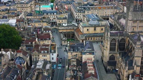 Drone aerial of the Roman Baths and Bath Abbey in Bath England Stock Footage 331452739