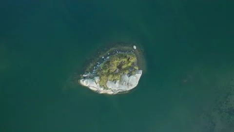 Drone aerial shoot of small remote island in the middle of the sea Stock Footage 131181298