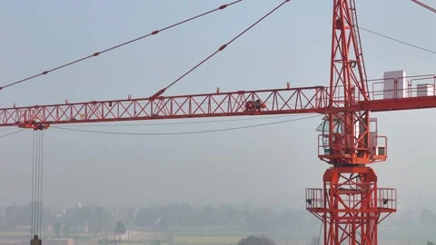 Drone aerial shot of crane at construction site with building in background Stock Footage 301753095