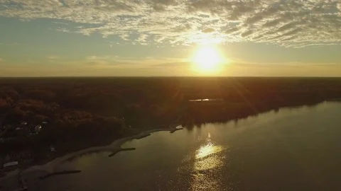 Drone aerial shot fall colors river forest in virginia sunset Stock Footage 84144705