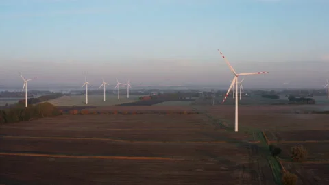 Drone aerial shot at large wind turbines producing clean sustainable energy Stock Footage 210257997