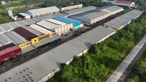 Drone Aerial Shot of Long Rows of Colorful Warehouses in Industrial Park Video stock 334374204