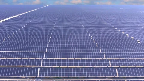 Drone aerial shot of photovoltaic array farm on vast Gobi land, clean solar 動画素材 338416342