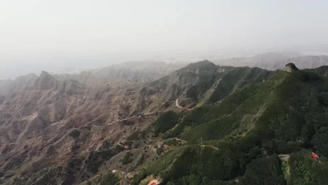 Drone Aerial Showing Contrast Between Rain Forest and Dry Mountains Video stock 330271678
