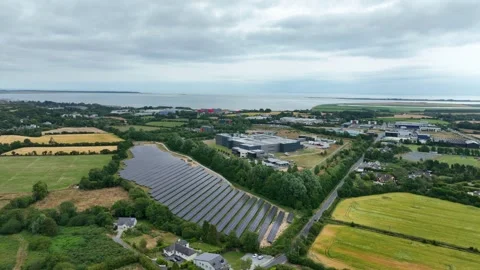 Drone aerial of solar panels next to food processing factory in County wexford Stock Footage 341353497