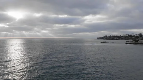 Drone Aerial of Sun Rays Breaking Through Clouds Over La Jolla Coastline - Stock Footage 342592706