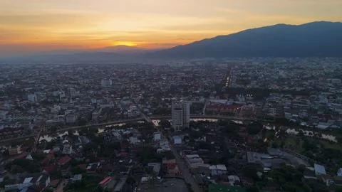 Drone aerial sunset of Chiang Mai Thailand cityscape old town temples Stock Footage 321858043
