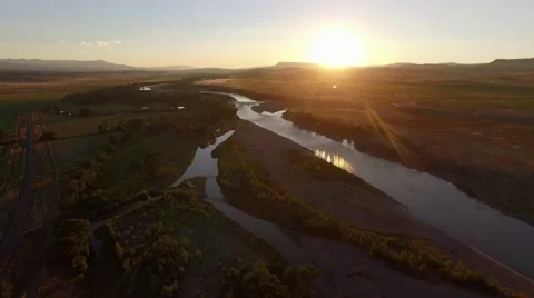 Drone Aerial of Sunset River and Field Stock Footage 69002553