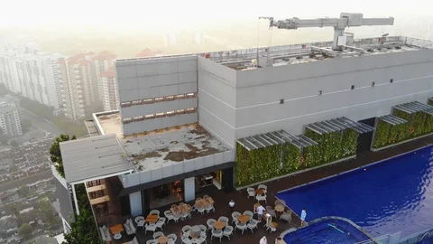Drone aerial sunset at rooftop pool bar Stock Footage 104322229
