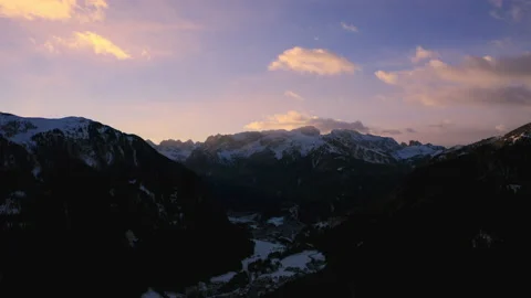 Drone aerial of Sunset through mountains in the Italian Alps IT ALP 0156 A GR Video stock 143289524