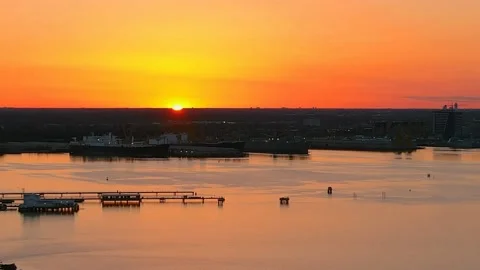 Drone (Aerial) Time Lapse of sun rising over Norfolk Virginia at sunrise Stock Footage 152929599