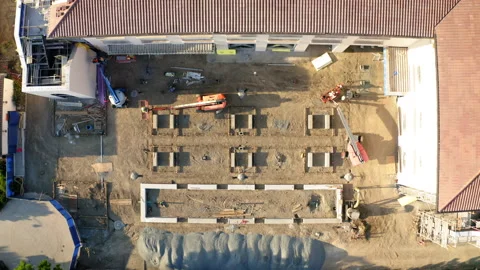 Drone Aerial Top-Down Lifting Up Over Building Construction Site Stock Footage 272702672
