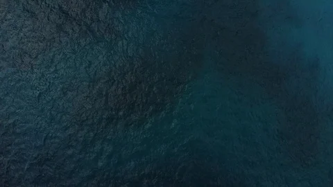 Drone aerial top down view of sea water towards cliff Stock Footage 114465523