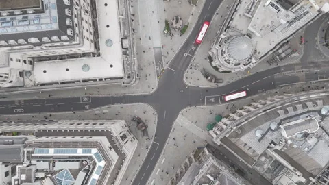 Drone aerial top down view of crossroads in London with London Buses Stock Footage 281078559