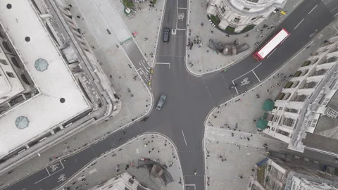 Drone aerial top down view of crossroads in London with London Buses Stock Footage 281078603