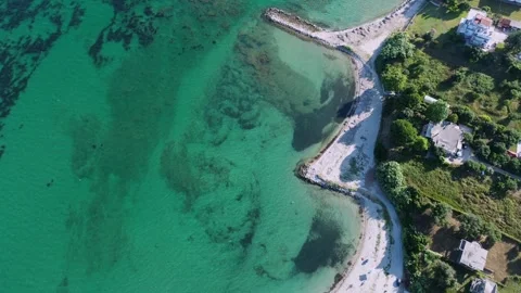 Drone aerial top down view of Kiani Akti beach bays and turquoise sea water in Vídeos de archivo 339079761