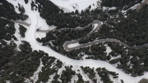 Drone aerial top down of windy Winter Roads in Italian Alps IT ALP DJI 0160 D Stock Footage 139946615