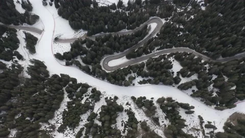 Drone aerial top down of windy Winter Roads in Italian Alps 0IT ALP DJI 0160 C 動画素材 139946623