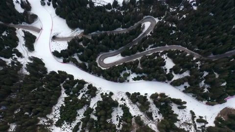 Drone aerial top down of windy Winter Roads in Italian Alps 0IT ALP 0160 C GR Stock Footage 143291783