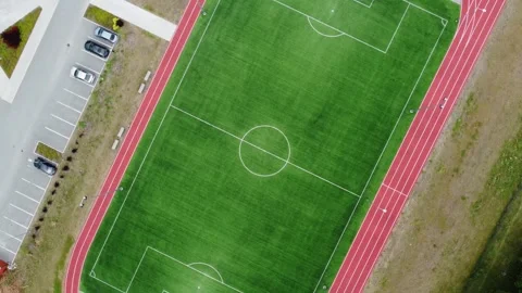 Drone aerial top view of empty new football field Stock Footage 247559040