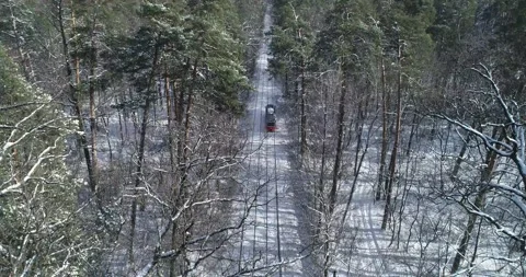 Drone. Aerial. Train going  white winter forest. Stock Footage 150980875