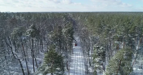 Drone. Aerial. Train going  white winter forest. Vidéo 150980976
