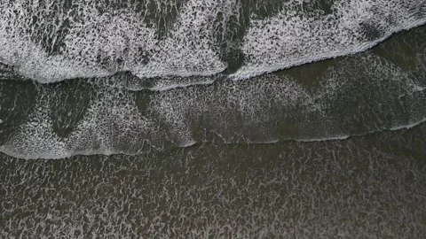 Drone aerial video of ocean waves and sea foam from above in Santa Catarina Stock Footage 316359491