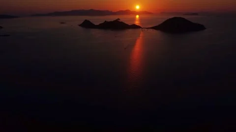 Drone aerial view of amazing sunset over sea. Burning sky and shining golden Stock Footage 237463522