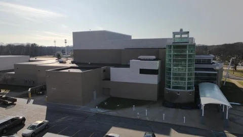 Drone aerial view ascending over empty parking lot outside modern public au.. Stock-Footage 337632392