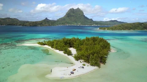 Drone aerial view Bora Bora Tahiti 4k. Tropical paradise island blue lagoon Stock Footage 143575859