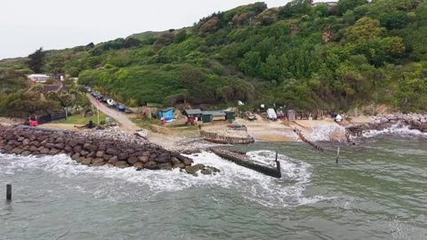 Drone Aerial View of Castlehaven Beach Sea Defense and Slipway Isle of Wight Stock Footage 336944872