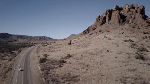 Drone Aerial View of Chisos Mountain Peak with car reverse Stock Footage 92550814