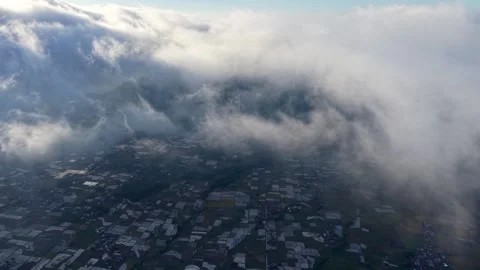 Drone Aerial View Clouds Rolling Over Patchwork Fields Stock Footage 347876052