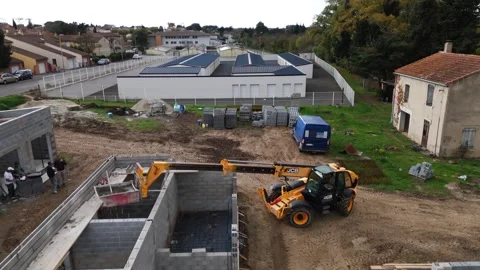 Drone Aerial View of Construction Site and Finished Storage Units in Urban Area 動画素材 335351596