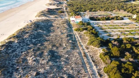 Drone Aerial View Costa da Caparica beach bar and railway in Portugal Video stock 145975576