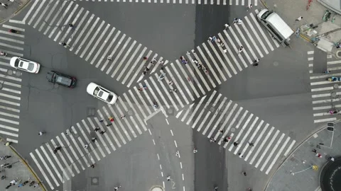 Drone aerial view of cross road with people and traffic cars in downtown Stock Footage