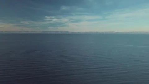Drone aerial view of deep blue lake in tundra mountains, baikal lake Stock Footage 211801928