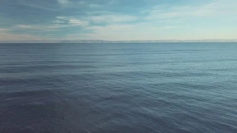 Drone aerial view of deep blue lake in tundra mountains, baikal lake Video stock 211802226