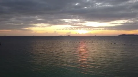Drone aerial view dolly side panning over beach,Crimson sunset with clear sky. Stock Footage 170538378
