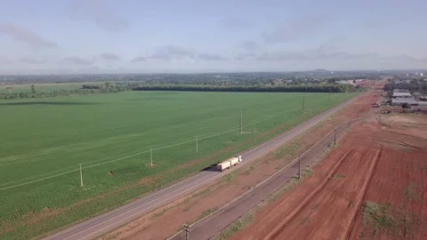 Drone aerial view of double semi truck loaded with soybeans driving on BR 163.  Stock Footage 147339058