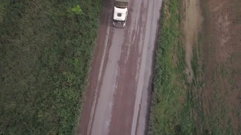 Drone aerial view of double semi truck loaded with soybeans driving fast BR 163 Stock Footage 148340790