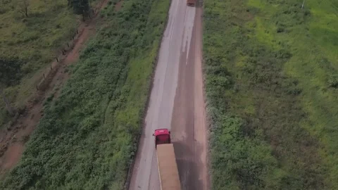 Drone aerial view of double semi truck loaded with soybeans driving fast BR 163 Stock-Footage 148340802
