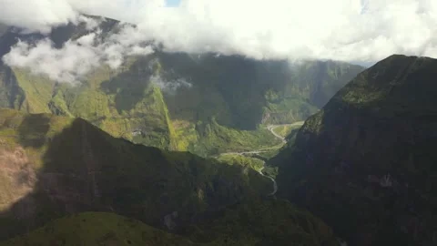 Drone Aerial View of Dramatic Green Mountain Valley with Winding River and Road Stock Footage 315091139