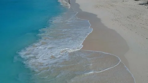 Drone aerial view of drone pilot on beach in Grace Bay, Providenciales, Turks Stock Footage 91113598