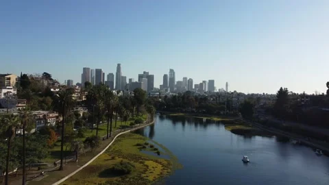 Drone Aerial View of Echo Park Lake and Downtown Los Angeles Buildings in Stock Footage 222750985
